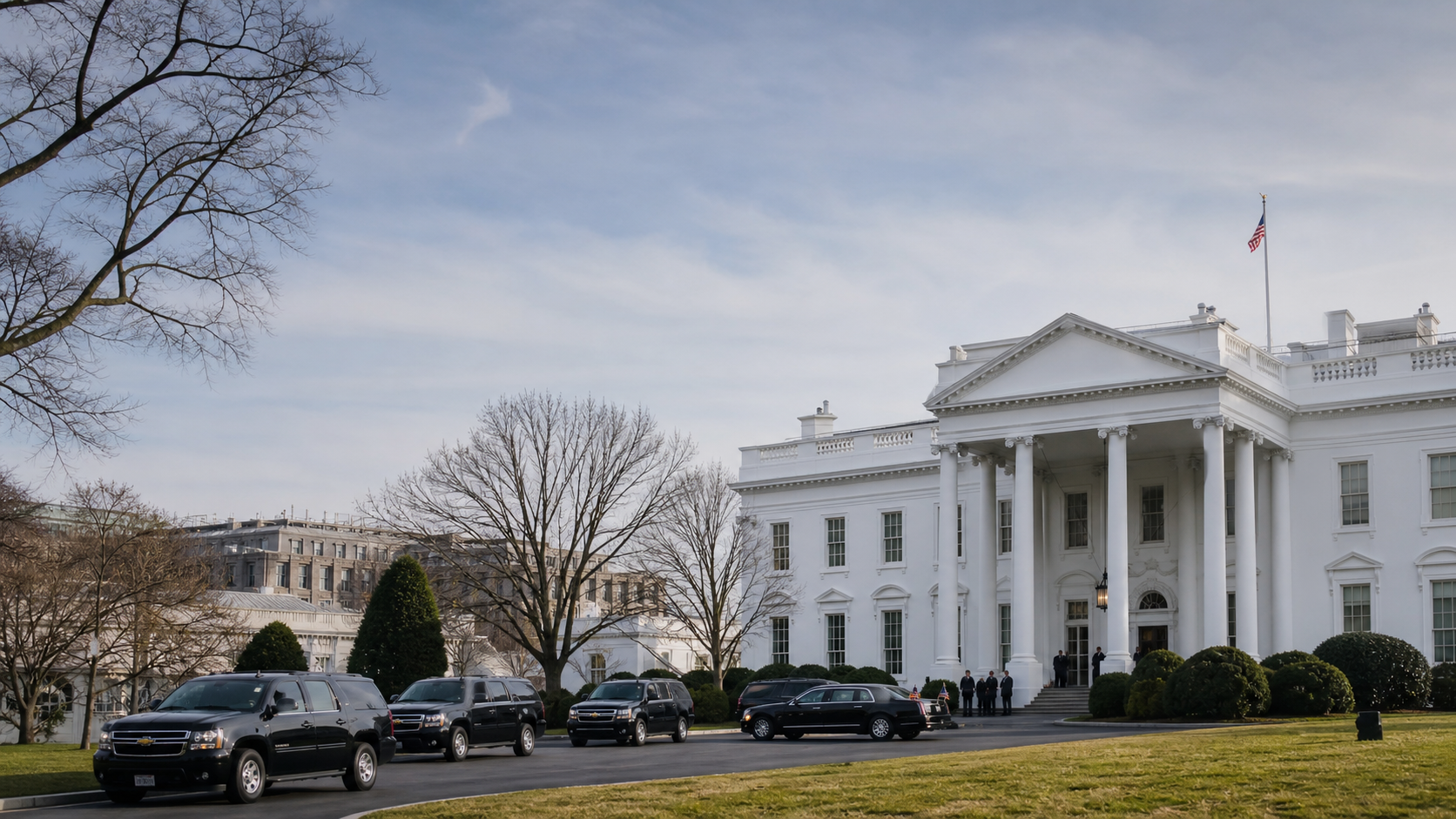 Exterior of the White House with a presidential motorcade area and flagpoles, photographed in natural light without close‑up people shots.