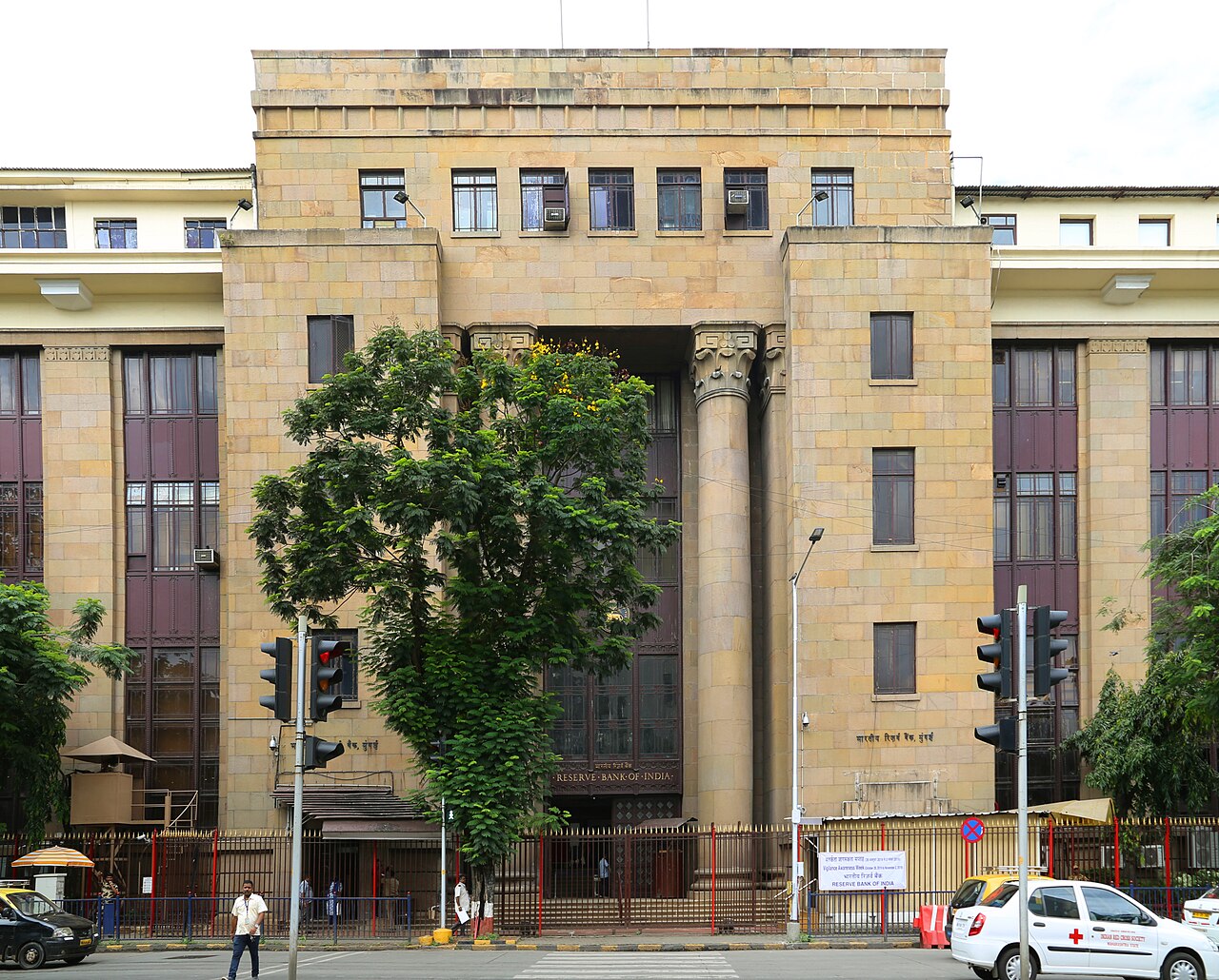 The Reserve Bank of India headquarters in Mumbai is seen from the street in daylight.