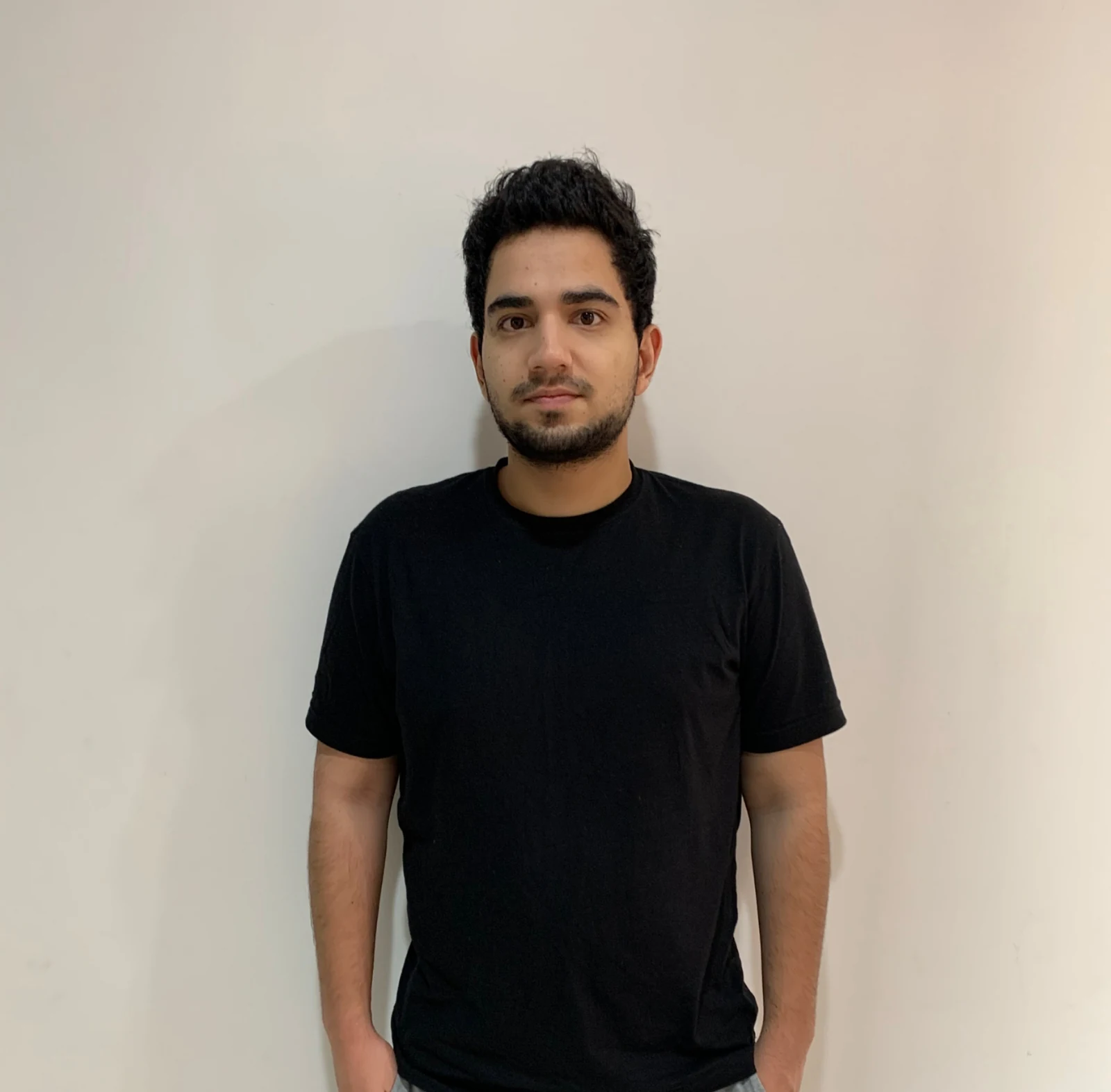 Samay Raina wearing a black T-shirt in an archive portrait