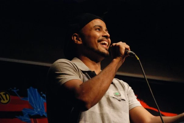 Sorabh Pant performing stand-up with a wired microphone in an archive photograph