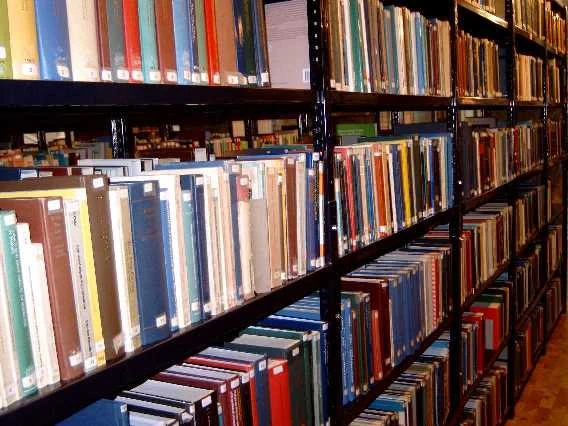 Real archive photograph of library bookshelves, photographed in 2016